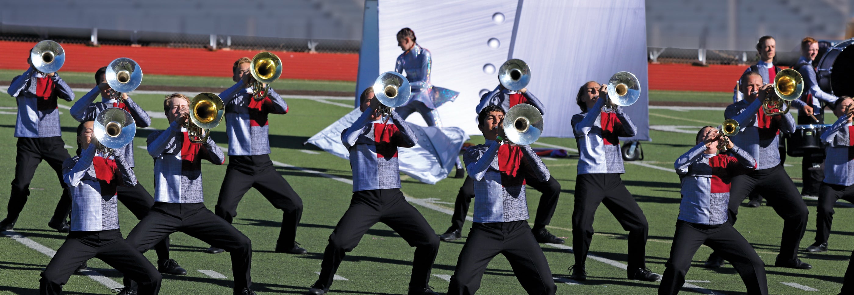 High school students wearing band uniforms for 2025